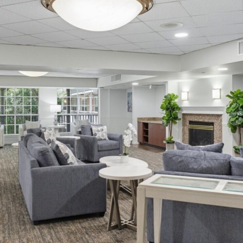 a living room with a tv and couches