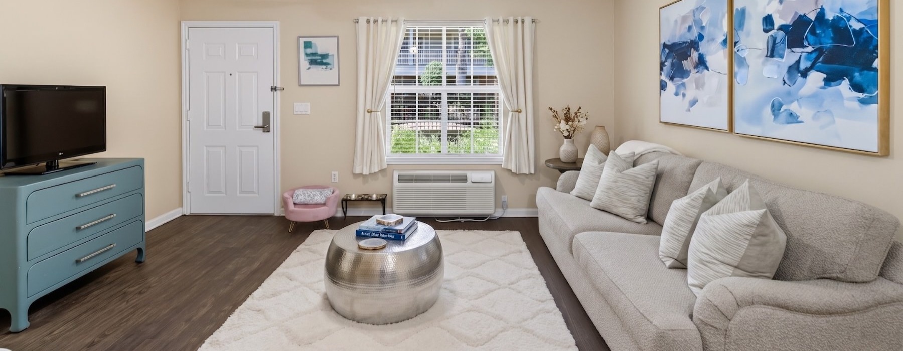 a living room with a couch and a tv