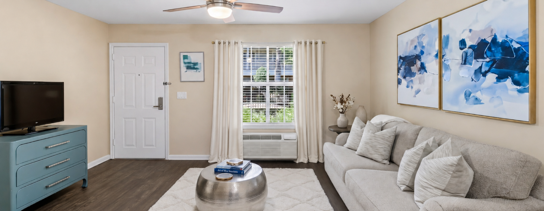 a living room with a couch and a tv