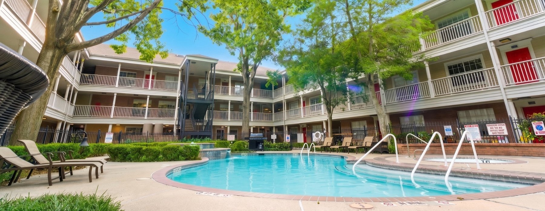 a swimming pool in front of a building