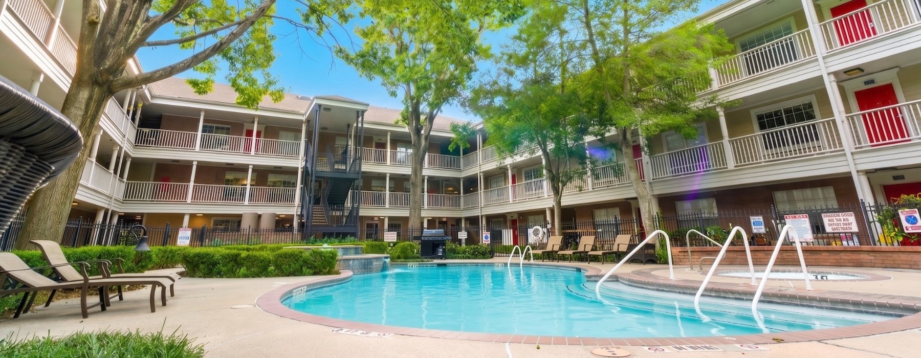 a swimming pool in front of a building